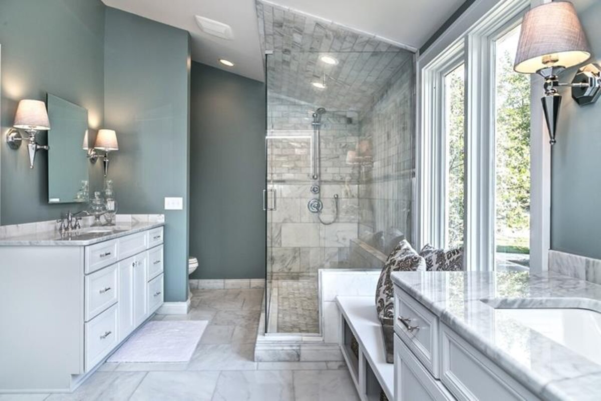 luxury bathroom renovation showing sleek fixtures and perfect lighting placement