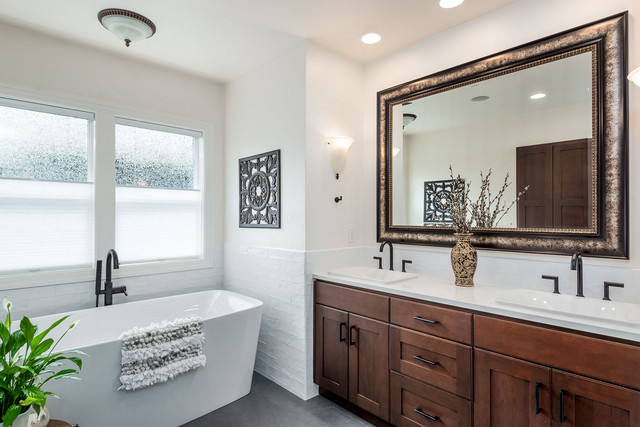 designer bathroom layout featuring floating sink and backlit mirror setup