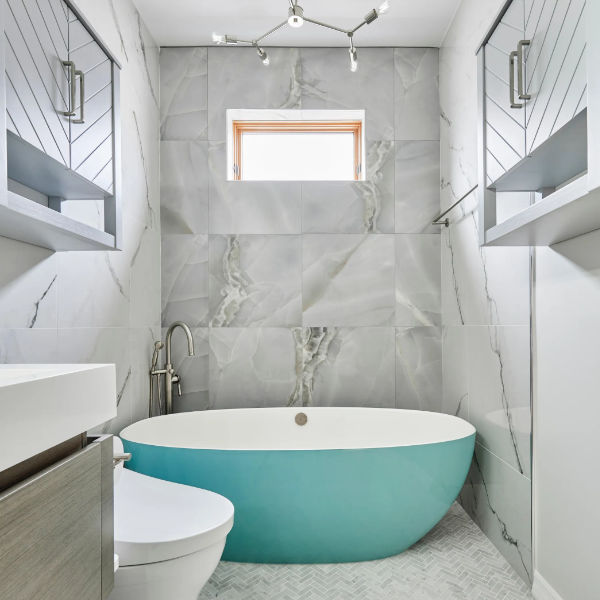 expert builder perfecting bathroom remodel with attention to every detail