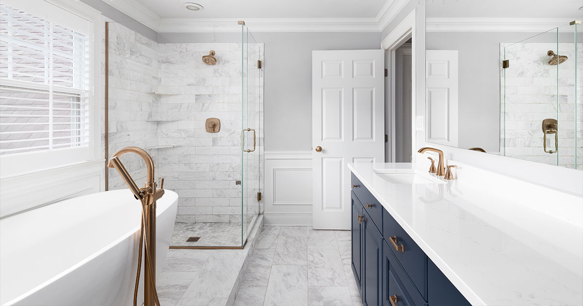 premium bathroom remodel featuring rainfall shower and frameless glass enclosure